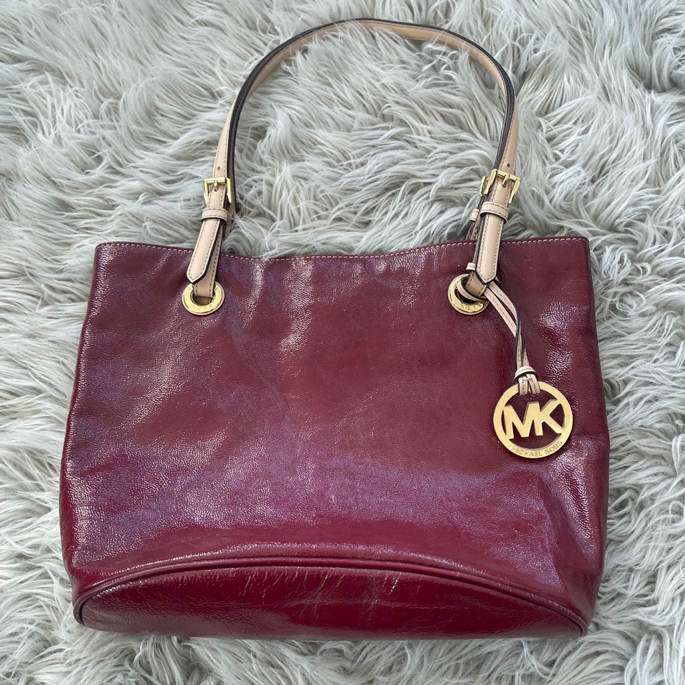 Michael Kors women’s dark red leather handbag.